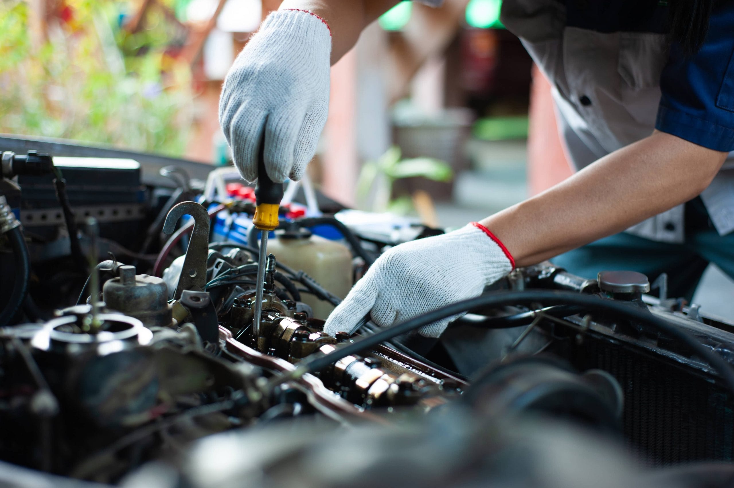 Professional mechanic repairing a car in an auto repair shop